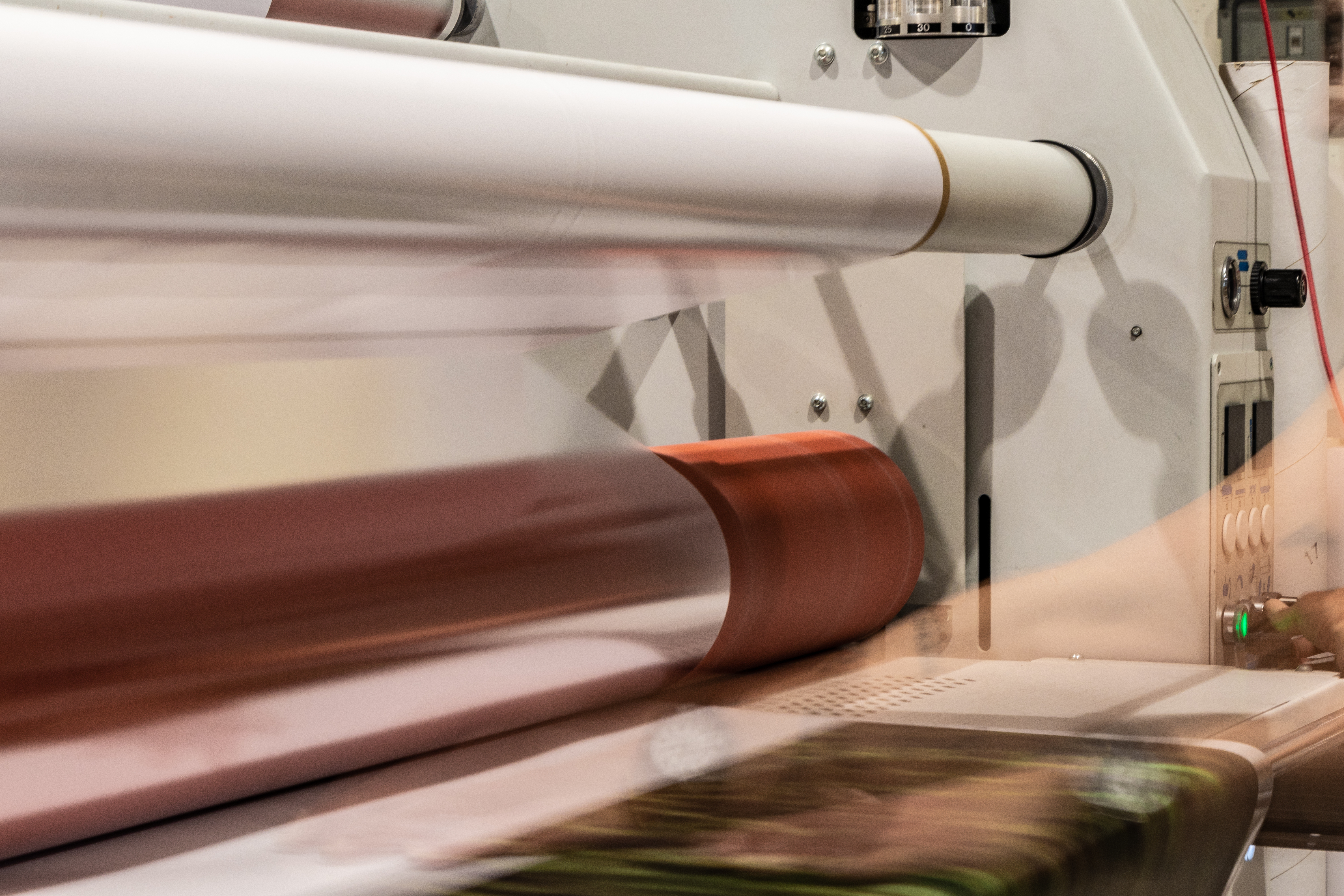 A long exposure photo of transparent packaging film being made.